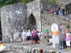 Singing at Clovelly Maritime Festival 'July 08. In front of the old lime kiln with some of Rum & Shrub looking down on us!